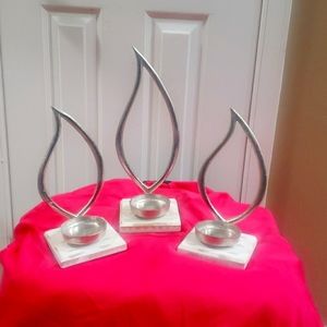 3 flame shaped tealight candle holders NWT. Never used